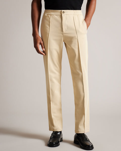 RODNY-Trousers-Make an entrance in the RODNY trousers. Exquisitely tailored and an excellent addition to any man's wardrobe, this pair of trousers will make your mark on the boardroom. Trousers Slim fit Zip and button fastening Elasticated waist Pockets Braided piping Joseph is 6'1" / 1.85m and wears Navy in 32 R- Ted Baker Romania